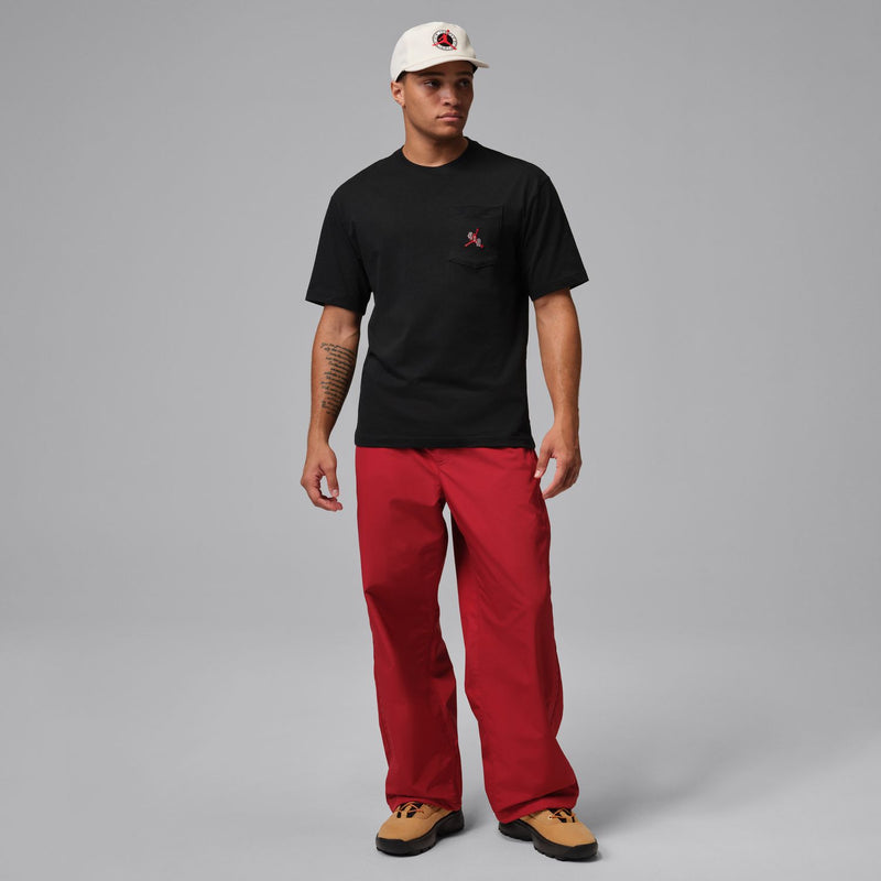 Men's black crewneck T-shirt with left chest pocket and small logo