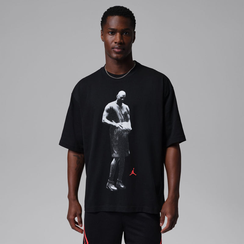 Men's black crewneck T-shirt with front white athlete graphic and red Jumpman