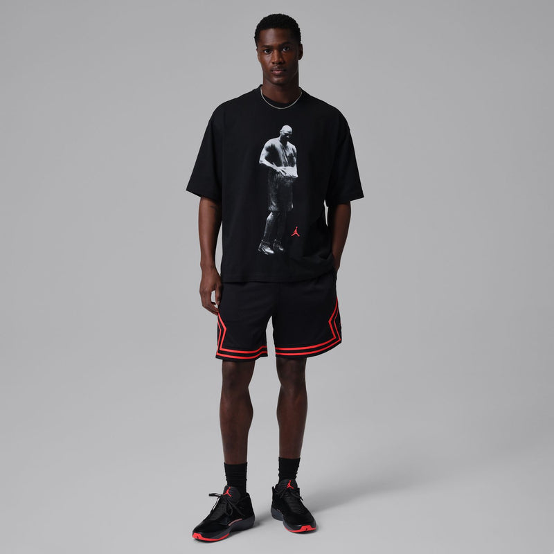 Men's black crewneck T-shirt with white athlete graphic print and red Jumpman
