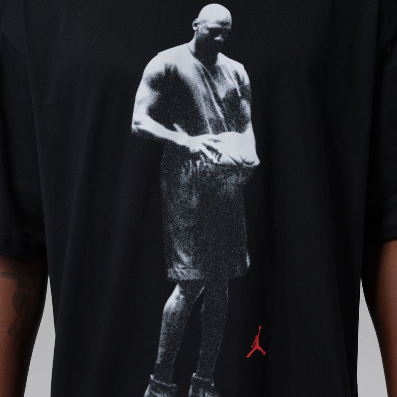 Black crewneck T-shirt with close-up white athlete graphic and red Jumpman logo
