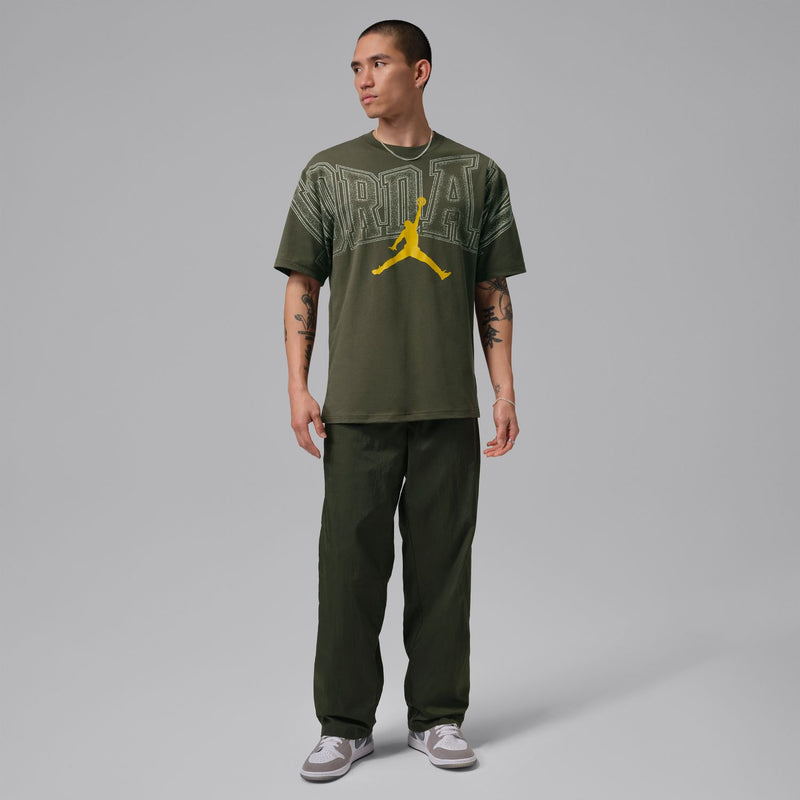 Cargo khaki graphic crewneck T-shirt with front Jumpman-style logo, side view