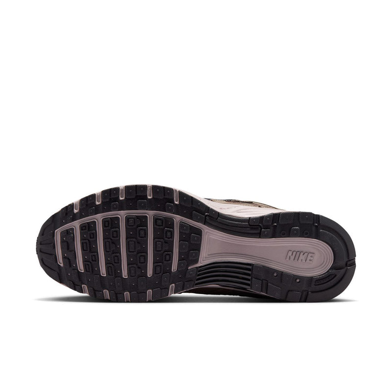 Men's sneaker outsole view, dark traction rubber with Nike mark on midsole