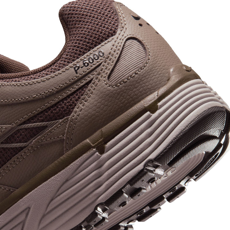Men's brown sneaker side close-up showing P-6000 label and ribbed midsole