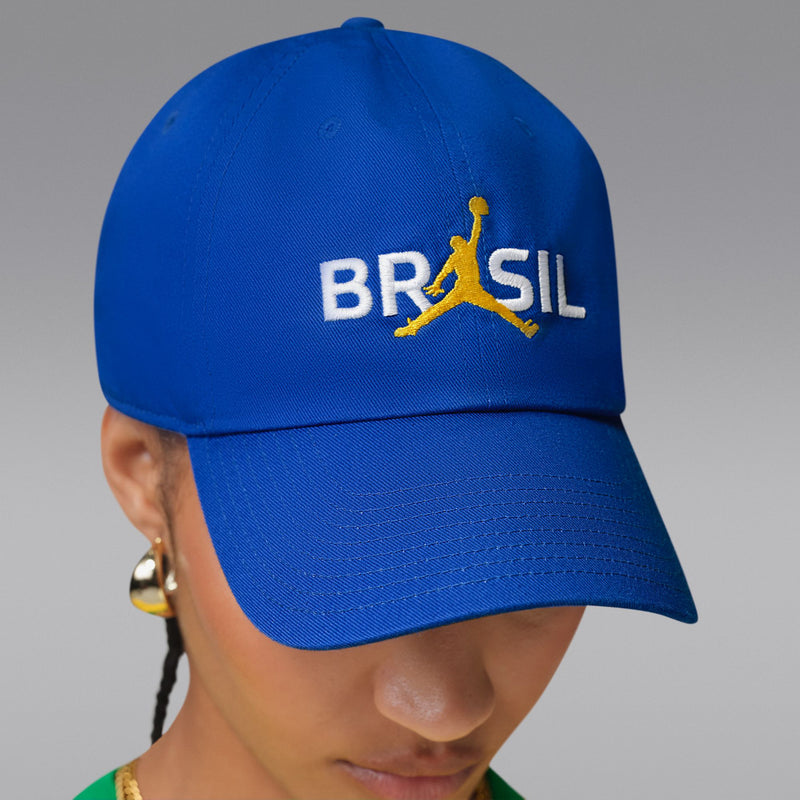 Old Royal blue snapback cap with BRASIL logo on the front panel, side view.