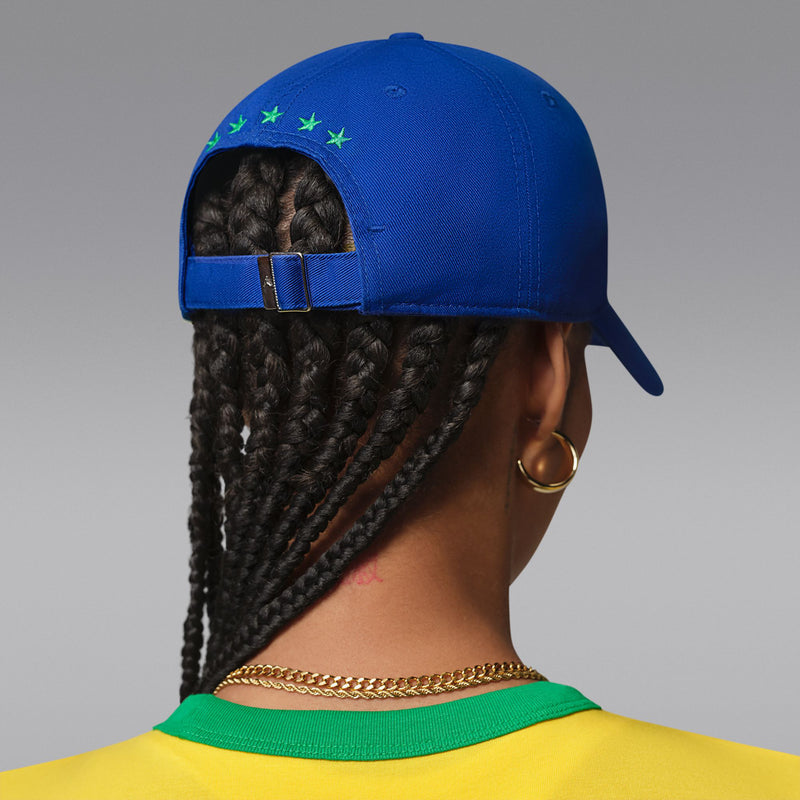 Old Royal blue snapback cap back view with green star detail and adjustable buckle strap.
