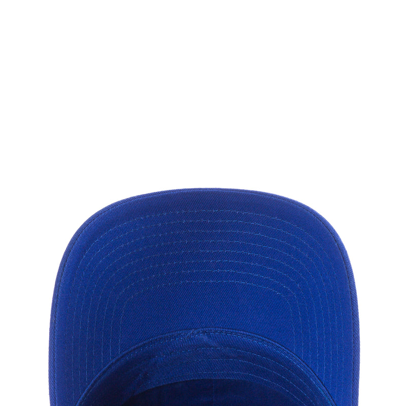 Old Royal blue snapback cap crown close-up with stitched panel lines and curved top.