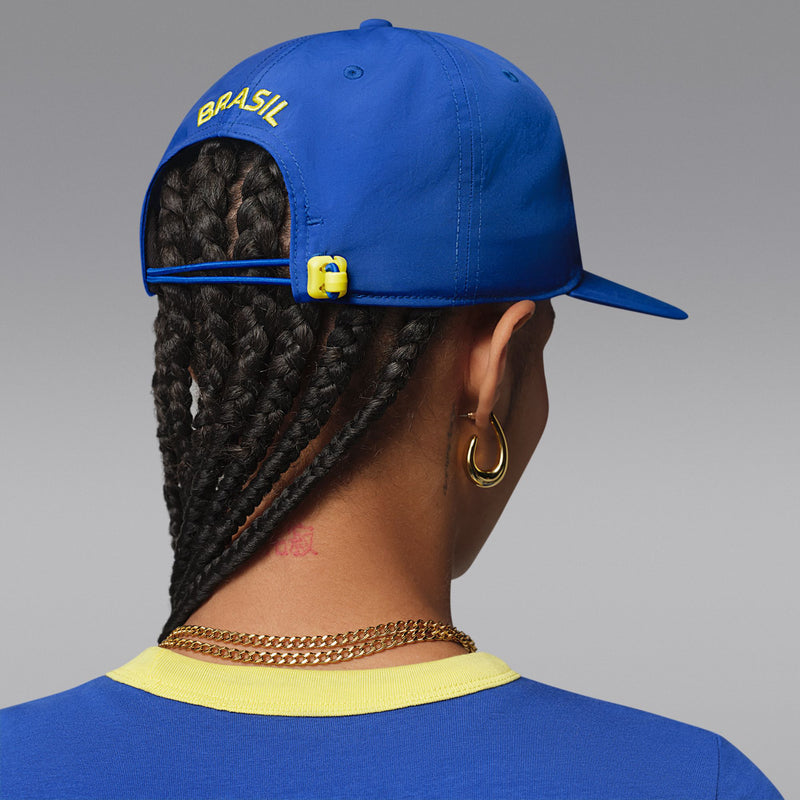 Royal blue snapback cap back with 'BRAZIL' text and yellow strap detail