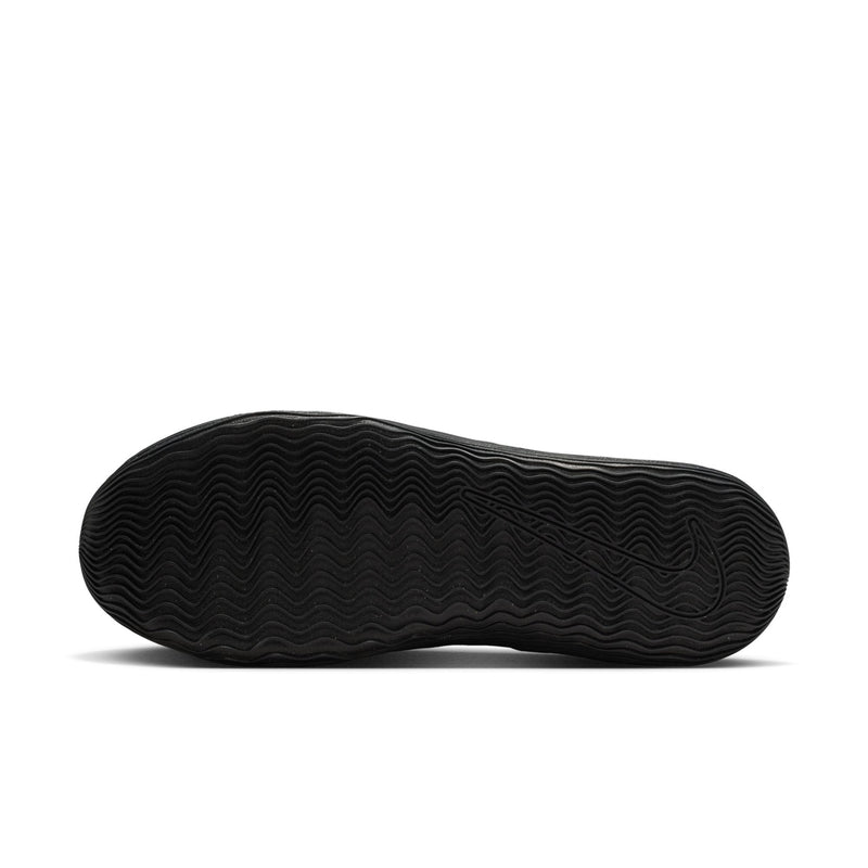 Men's black outsole tread on low-top sneakers, textured rubber bottom