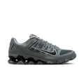 Men's training shoes in smoke grey with black accents and a chunky rubber outsole.