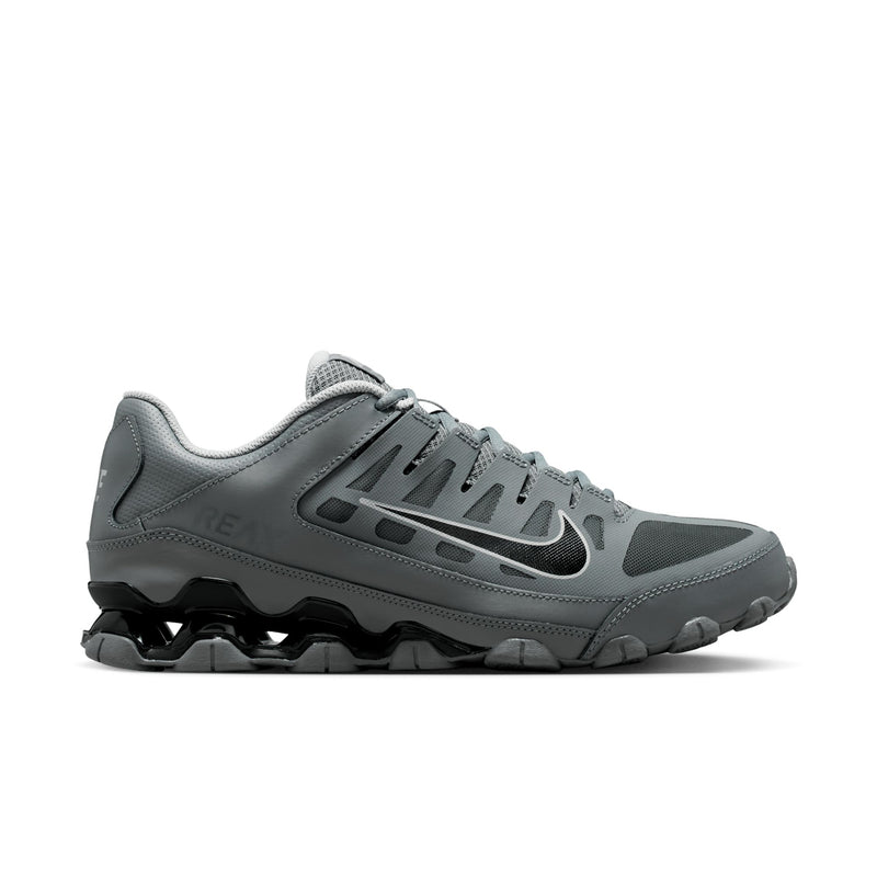 Men's training shoes in smoke grey with black accents and a chunky rubber outsole.