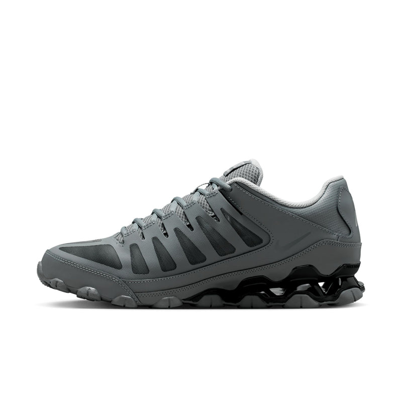 Men's training shoes side profile: smoke grey upper with black details and rugged tread outsole.