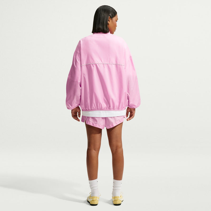 Women's pink windbreaker jacket from back with elastic cuffs and hem