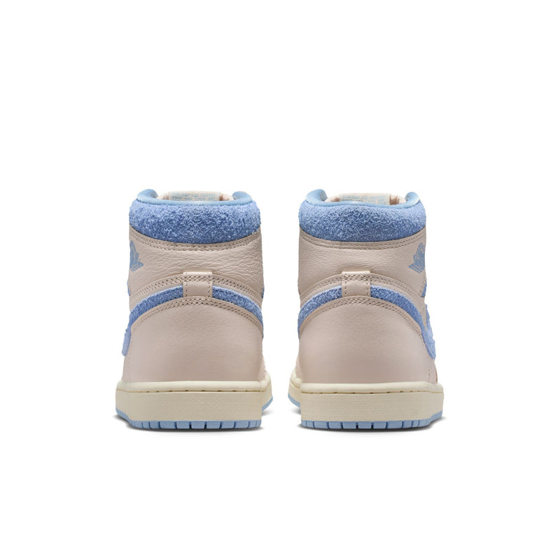 Back view of women’s high-top sneakers in pale ivory with light blue heel and collar.