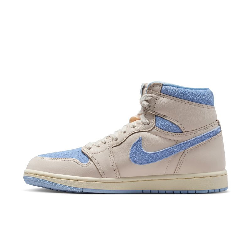 Side view of women’s high-top sneakers in pale ivory with light blue Swoosh and trim.