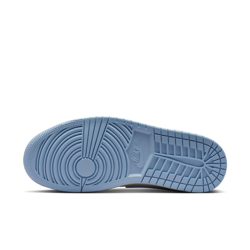 Blue rubber outsole of the high-top sneakers, textured tread for grip.