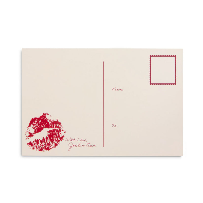 Beige gift card with red lip print and handwritten-style note reading "from" and "with love"