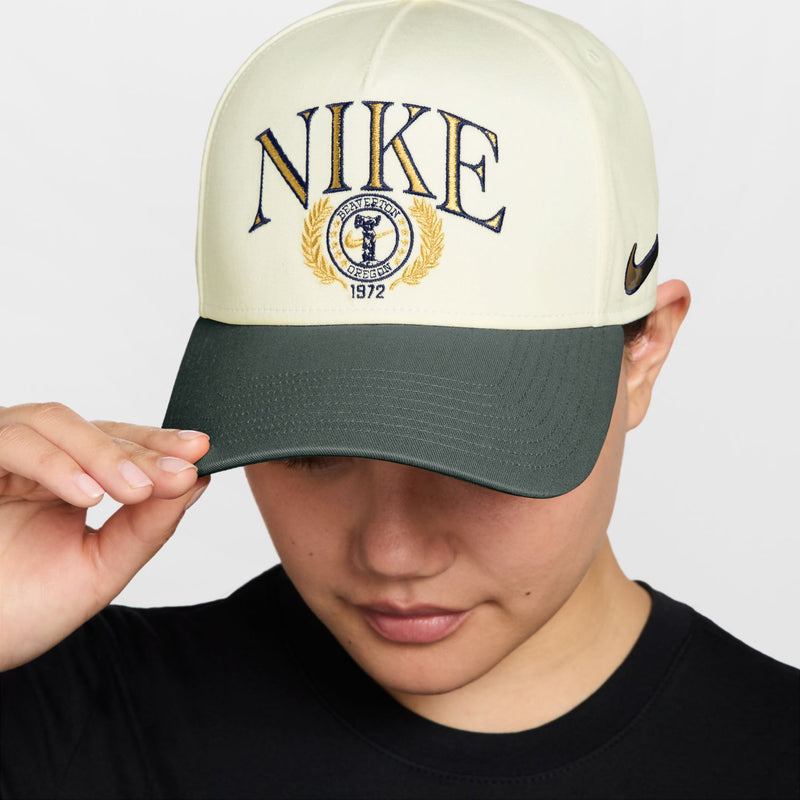 Nike structured curved-bill snapback cap in sail and dark green with embroidered logo