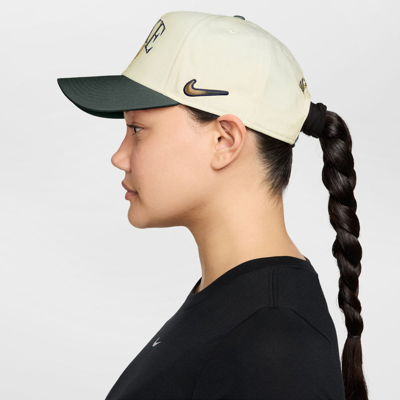 Sail snapback cap with dark green underside brim, side profile, Nike swoosh on crown.