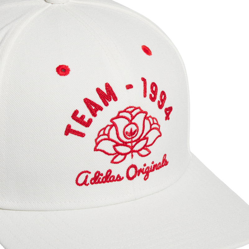 Off-white snapback cap close-up with red TEAM-1994 rose and adidas Originals