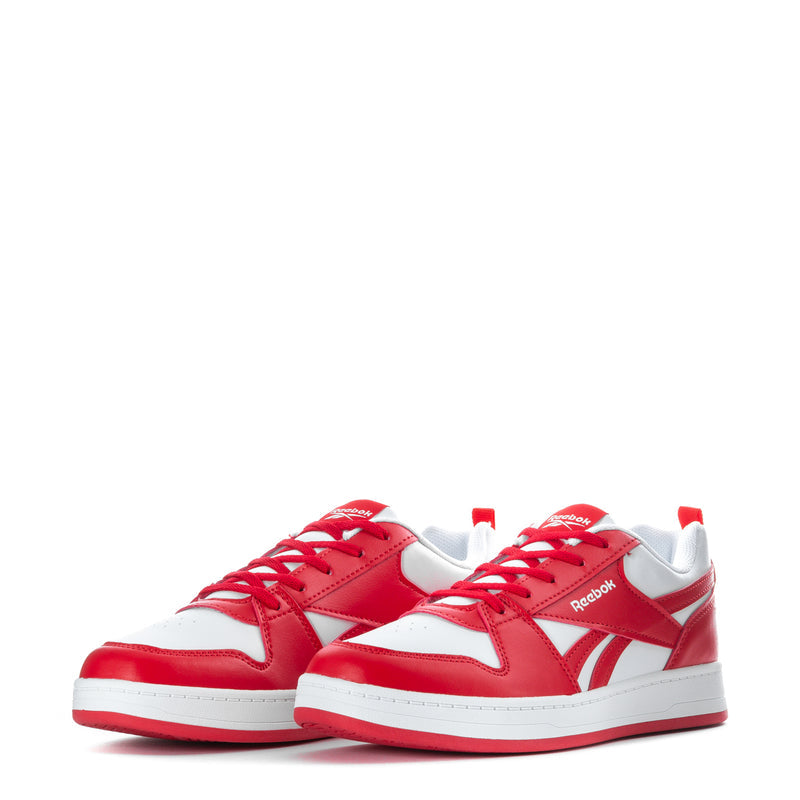 Pair of youth red and white Reebok low-top sneakers, front view