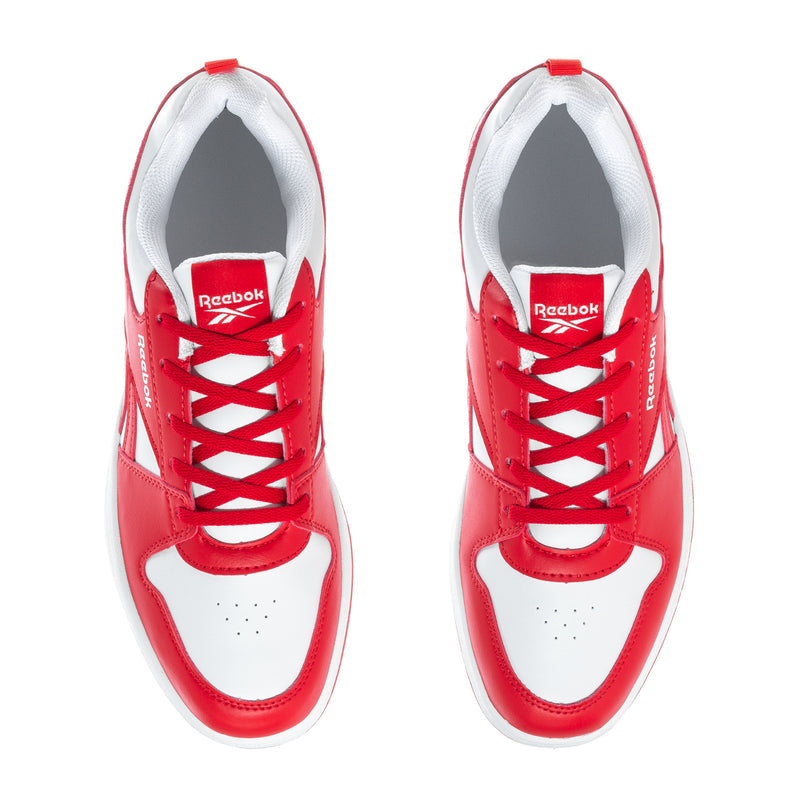 Youth red and white Reebok sneakers, tongue and lace eyelets detail