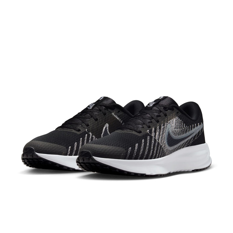 Pair of women's black trainers with gray knit pattern, laces, and white sole