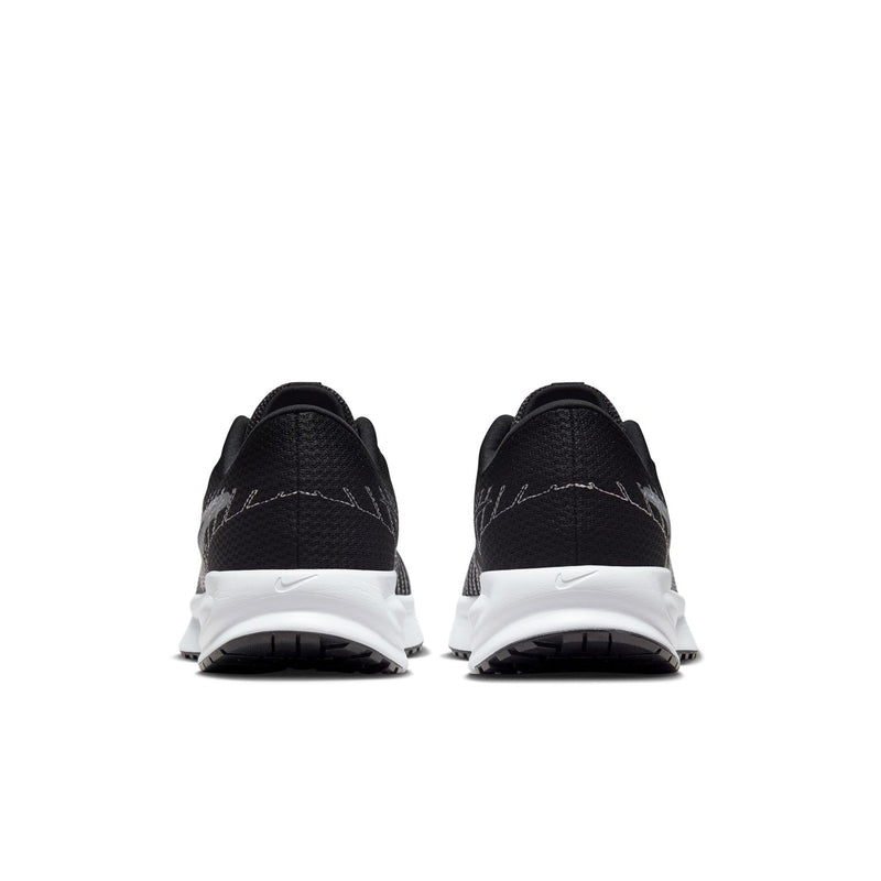 Women's black running shoes with white heel foam and padded back collar