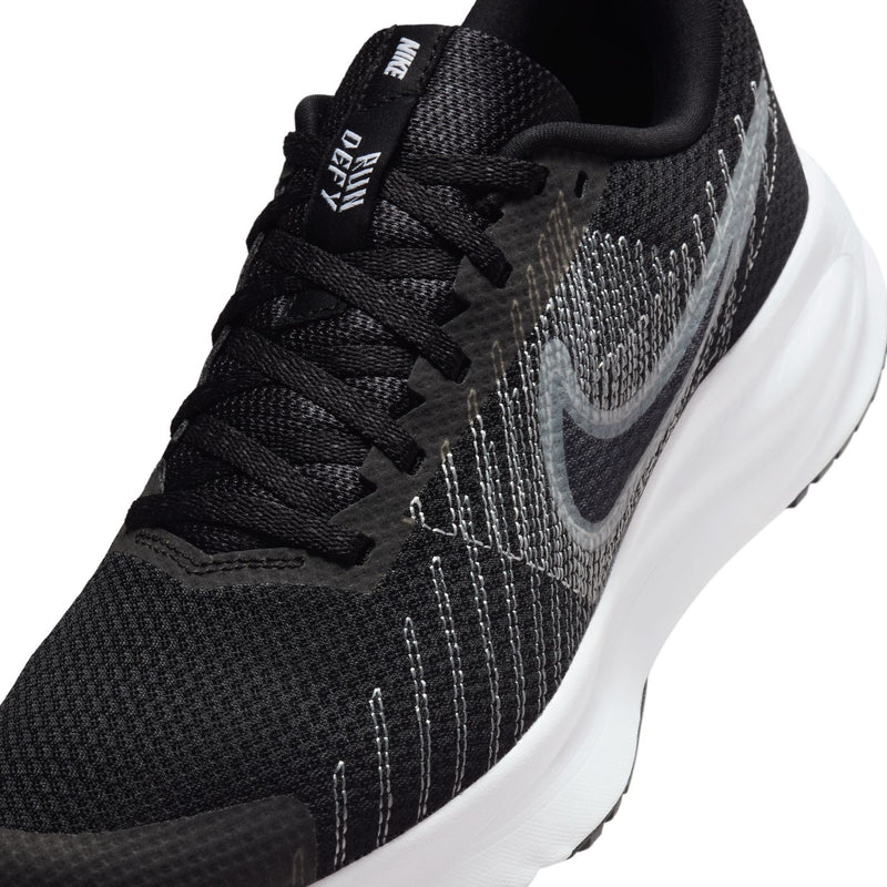 Women's black knit upper close-up with gray swoosh and black laces