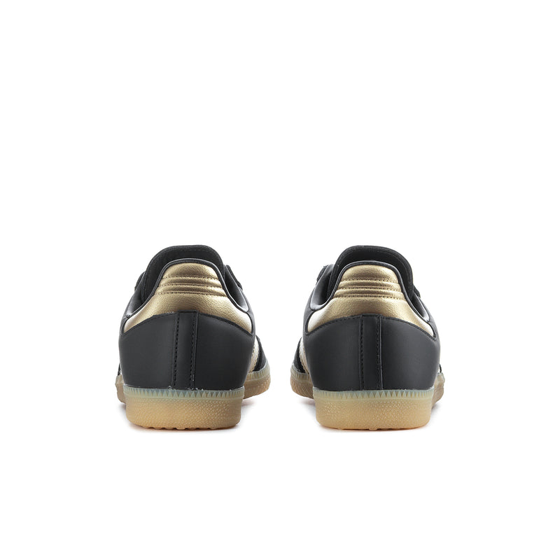 Samba OG women's sneakers rear view, black heel with gold accents and gum sole