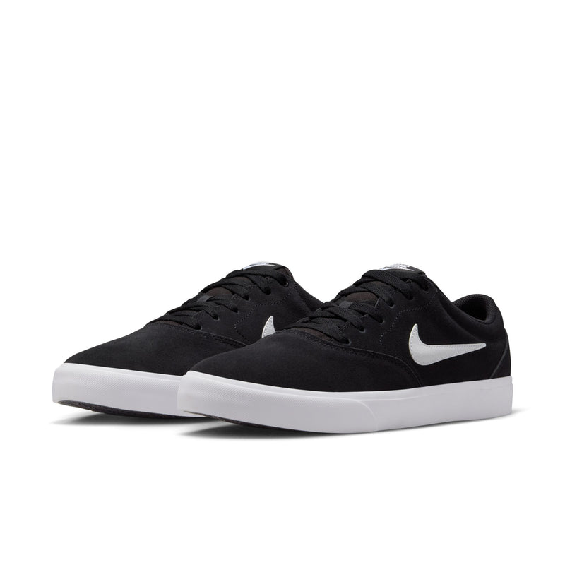 Pair of men's black low-top skate sneakers with white midsoles and Nike Swoosh detail.