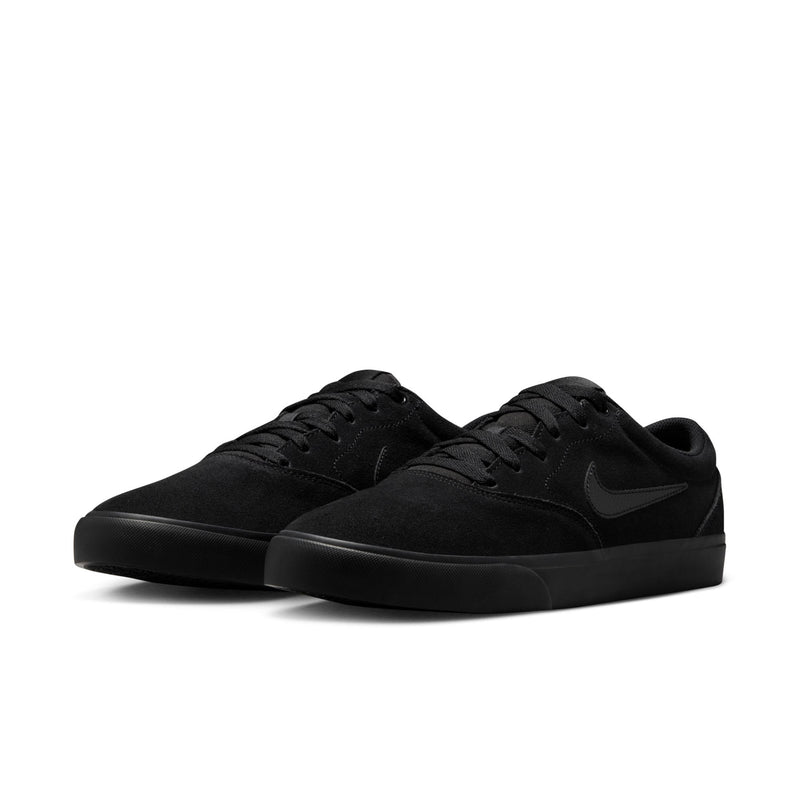 Pair of black low-top skate sneakers with lace-up closure and Nike Swoosh overlays.
