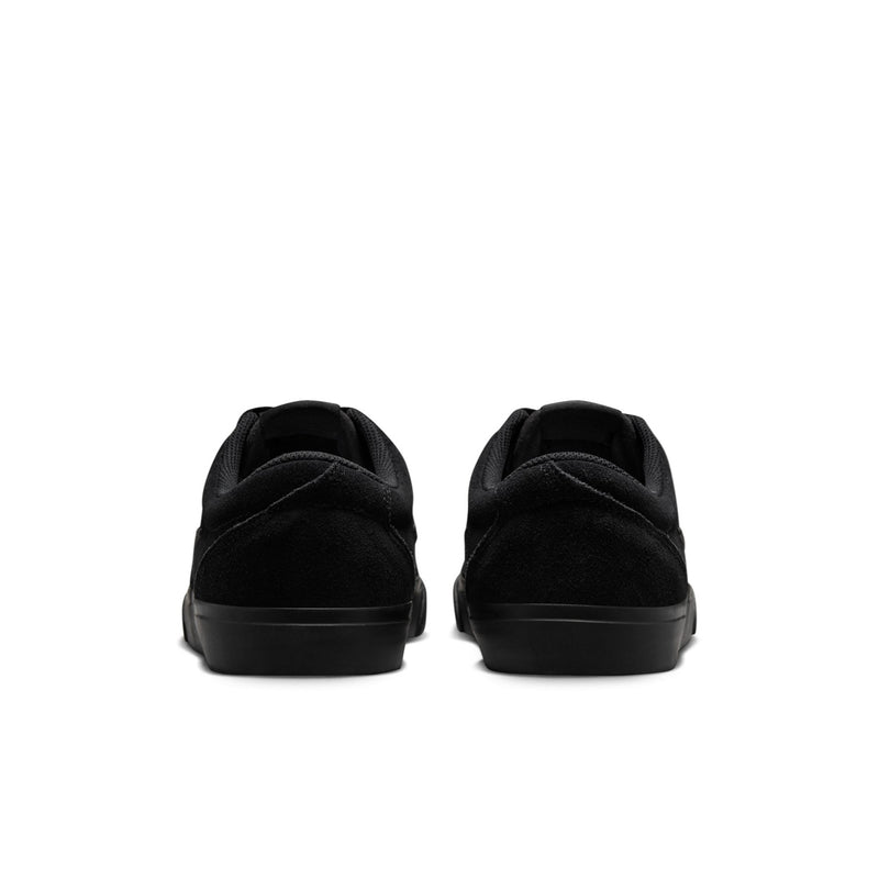 Black low-top skate sneaker heels, showing back seam and cushioned heel collar.