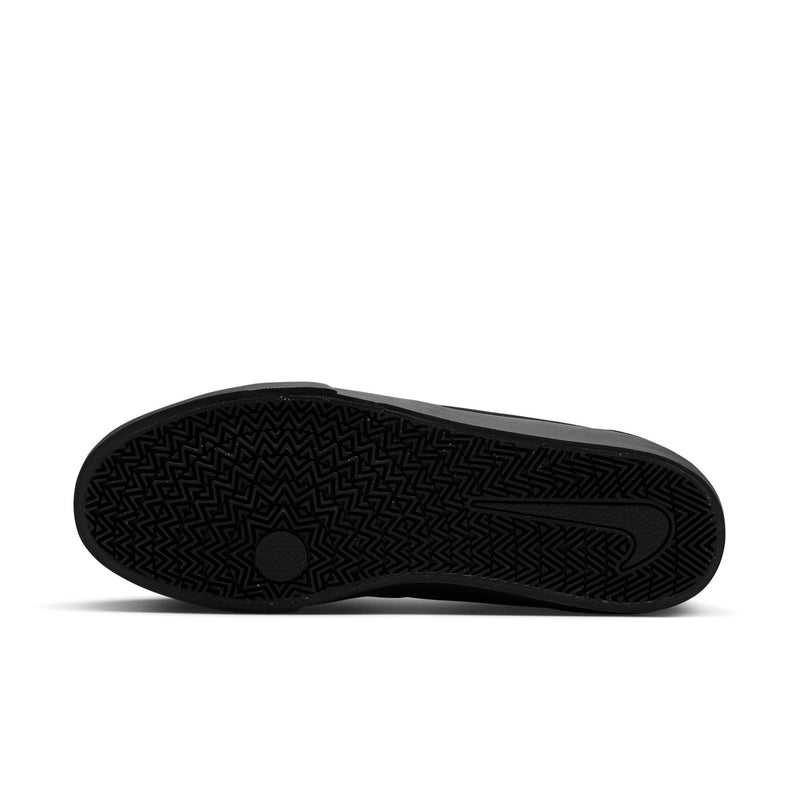 Black rubber outsole with textured tread pattern for grip and traction.