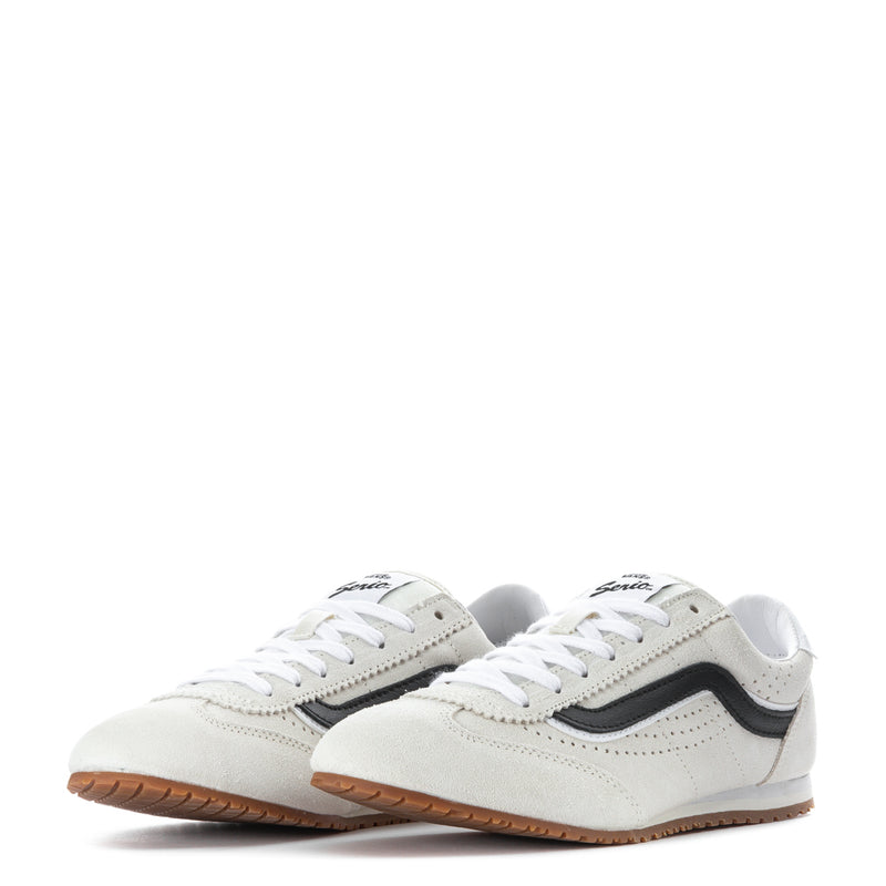 Pair of women's low-top off-white sneakers with black side stripe and gum outsole