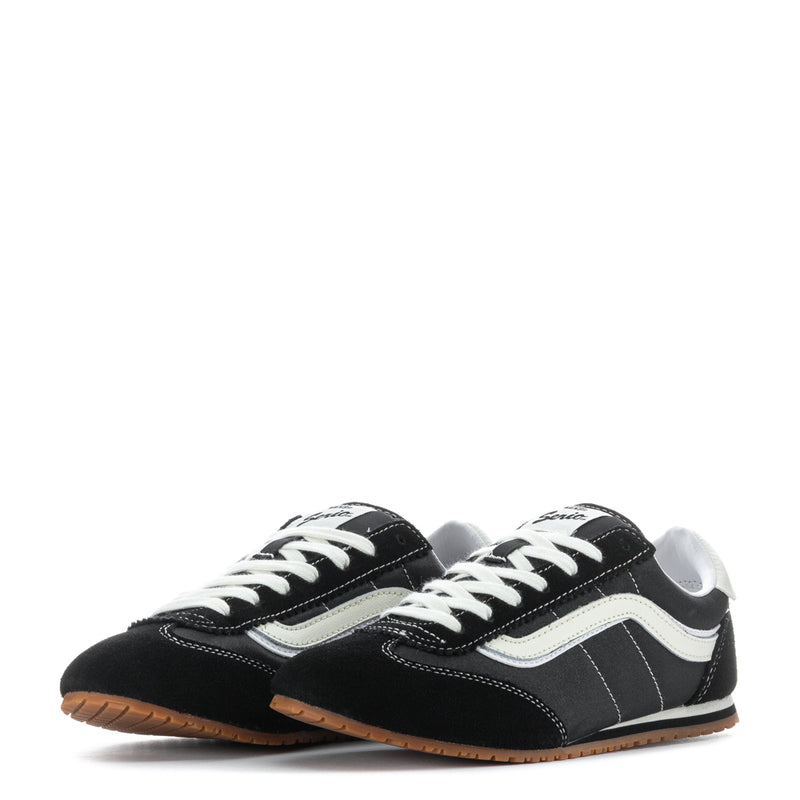 Women's low-top sneakers pair, black uppers with white stripe, lace-up, gum outsole