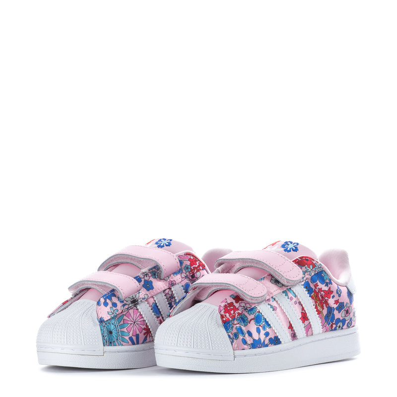 Toddler sneakers with pink hook-and-loop straps and floral print upper, white rubber sole.