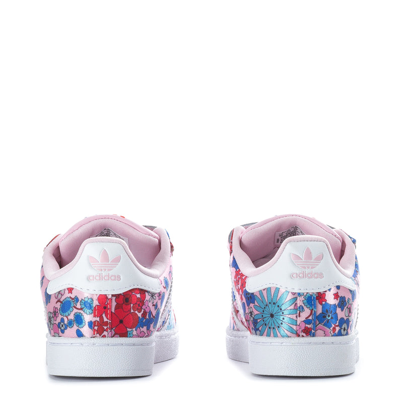 Toddler sneakers back view with pink lining and floral print, white heel cup.