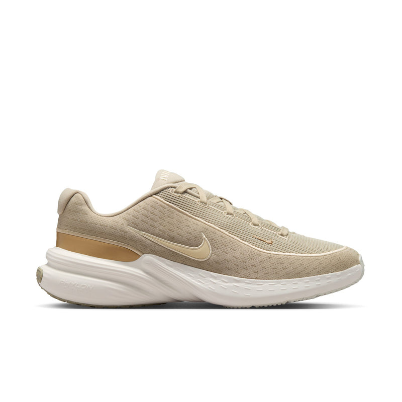 Beige men's running shoe with Nike logo and cushioned white sole.