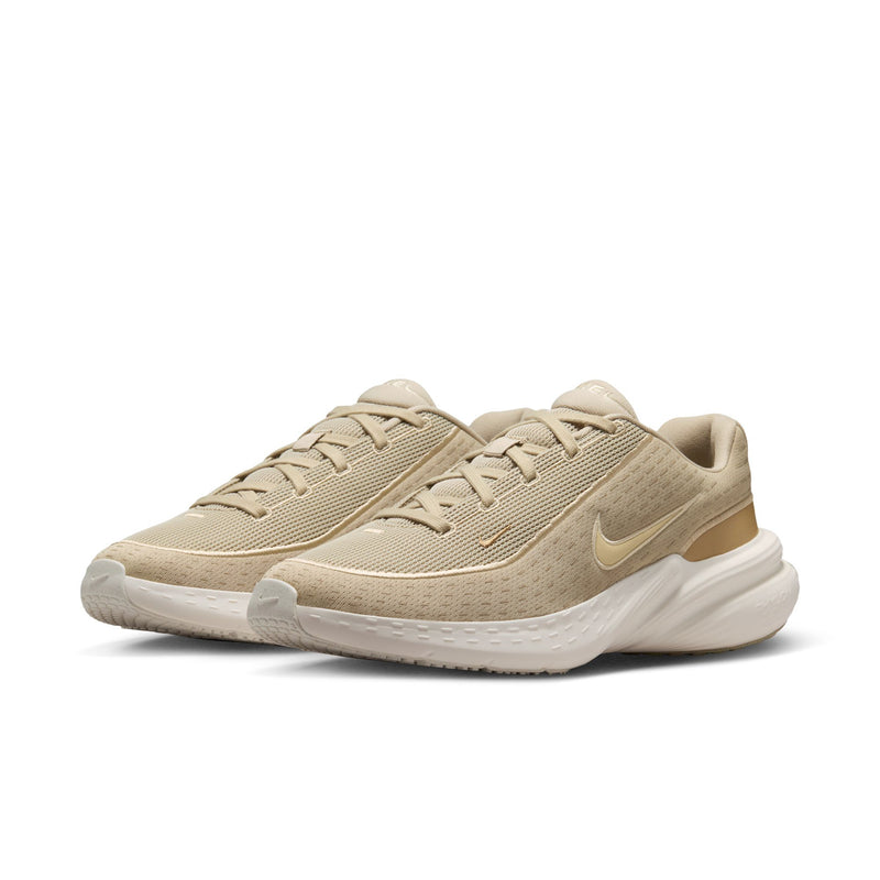 Beige knit men's running shoe with Nike swoosh and white midsole.