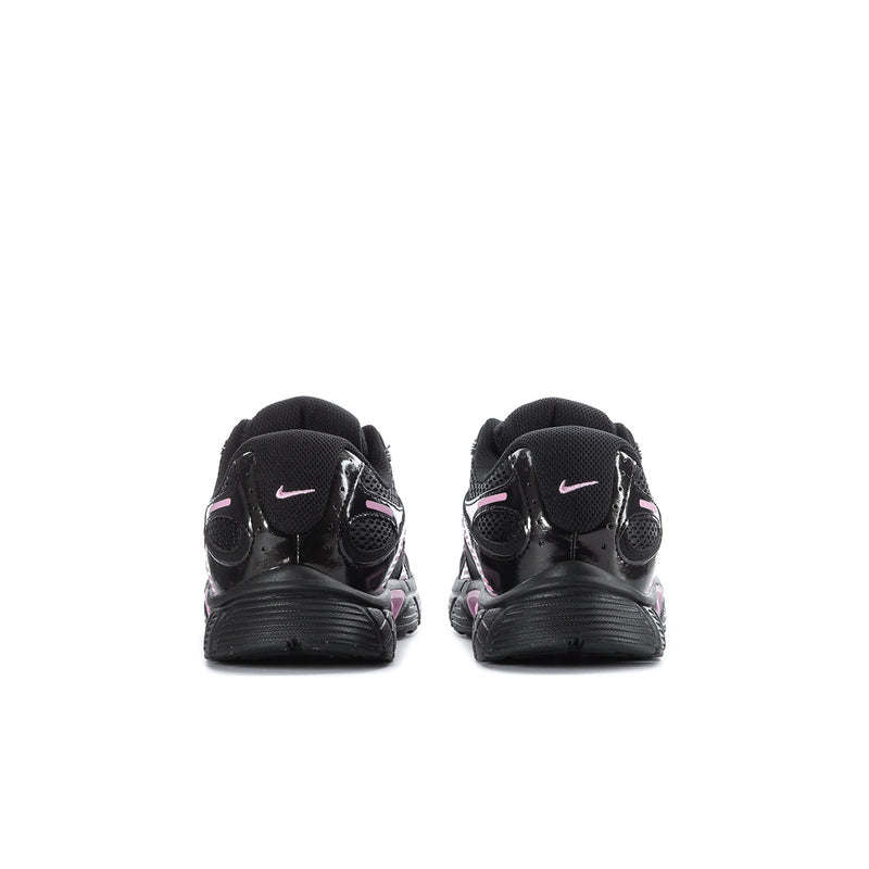 Youth running shoe heels, black with pink accents and Nike Swoosh on back.