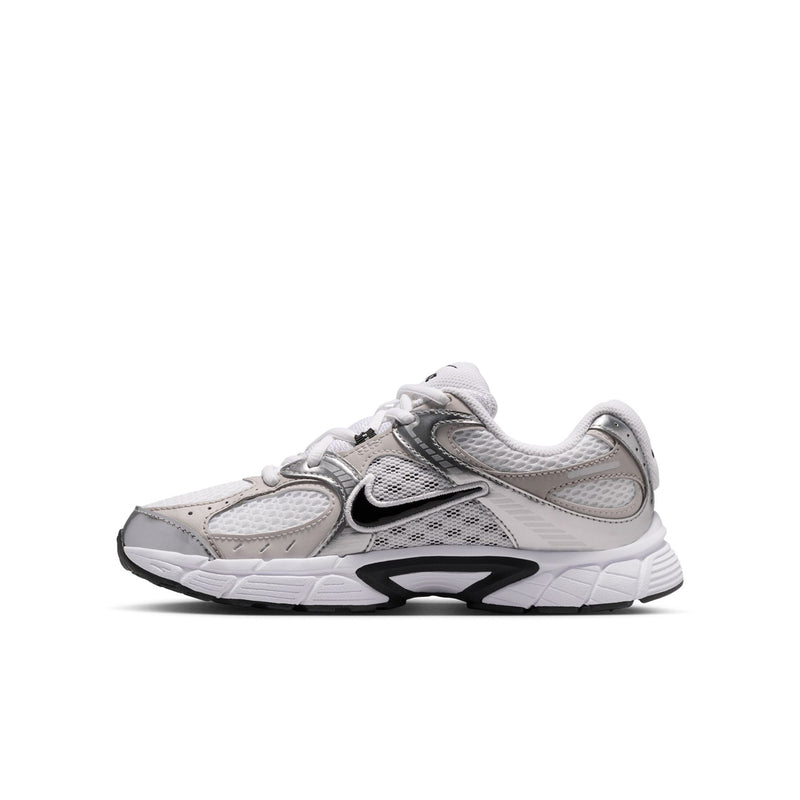 Youth running sneaker side view in white and light gray with black swoosh detailing