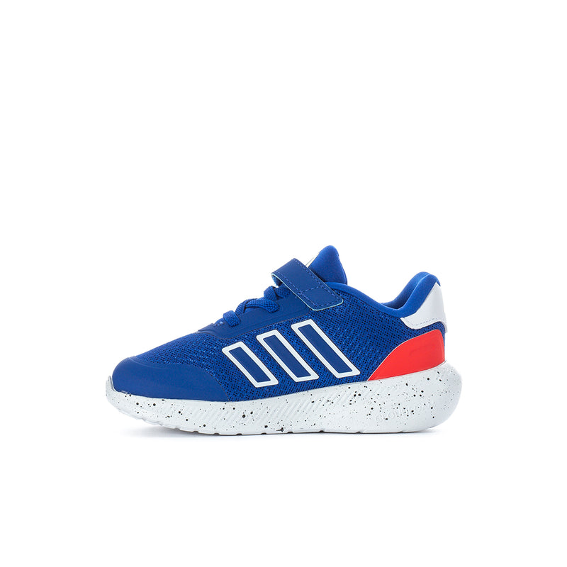 Toddler sneakers, side view: royal blue upper, white logo stripes, red side panel