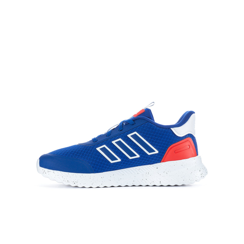 Youth sneakers side view: blue upper, white midsole, red heel panel, three-bar stripes.